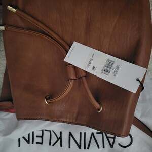 Calvin Klein Grabrianna Drawstring Bucket Crossbody Bag in Cognac